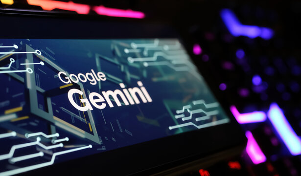 Viersen, Germany - February 9. 2024: Closeup of Smartphone screen with logo lettering of Google Gemini on computer keyboard
