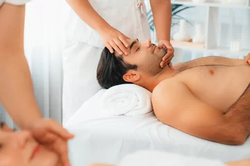Poster Caucasian couple enjoying relaxing anti-stress head massage and pampering facial beauty skin recreation leisure in dayspa modern light ambient at luxury resort or hotel spa salon. Quiescent © Summit Art Creations