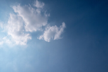 blue sky with white clouds sunray background