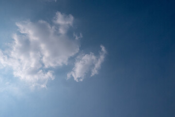 blue sky with white clouds sunray background