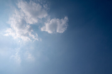 blue sky with white clouds sunray background