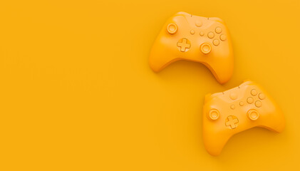 Video game joysticks or gamepads in plain monochrome yellow color background © Vasyl Onyskiv