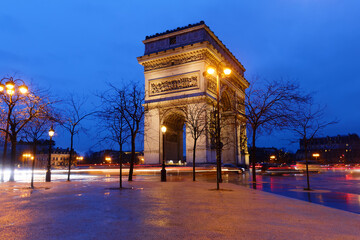 The Triumphal Arch in rainy evening, Paris, France. - 750137274