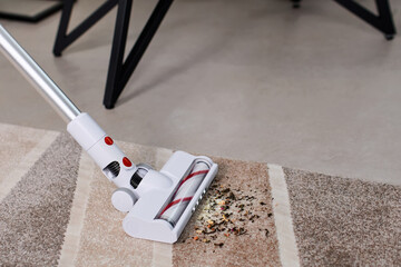 Home electronics concept, vacuum cleaner collects dirt