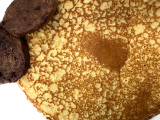 Pancake and sausage patties on a white background