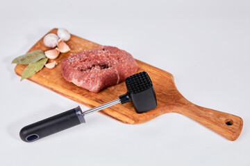 Kitchen concept, meat and milk lie on a wooden board