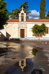 Obraz premium Traditional Greek orthodox church just after the rain, in a village in Rethimno region, Crete island, Greece, Europe. 