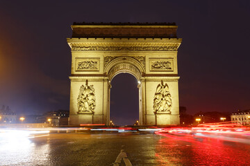 The Triumphal Arch in rainy evening, Paris, France. - 750144430