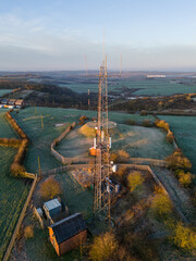 Rural communication tower at sunrise