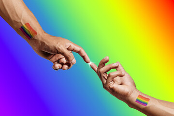 Tattooed hands with rainbow colors, about to touch, representing unity and celebration. Pride Month