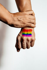 A hand tattooed with the colors of the rainbow. Concept of unity and celebration. Pride Month
