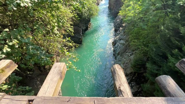The Bolshaya Laba River. A mountain emerald river in a narrow, sunlit canyon. Bolshaya Laba River near the village of Psemen in Karachay-Cherkessia, Russia. Panoramic view. 4K