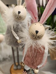 Bunny couple home decoration with wooden egg heads and fluffy collars