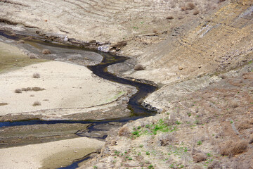 Bottom of a dried out water reservoir lake in California