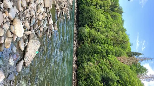 The Bolshaya Laba River. A mountain emerald river in a narrow, sunlit canyon. Bolshaya Laba River near the village of Psemen in Karachay-Cherkessia, Russia. Panoramic view. 4K