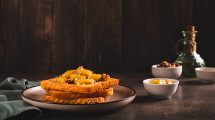 Toasts with caramelized banana, honey and walnuts for breakfast on the table web banner
