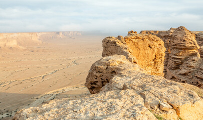 Fototapeta na wymiar The Jabal Tuwaiq Mountains, with desert below landscape, Riyadh, Saudi Arabia
