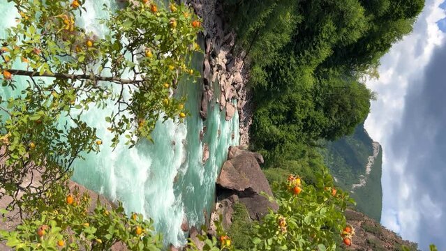 The Bolshaya Laba River. A mountain emerald river in a narrow, sunlit canyon. Bolshaya Laba River near the village of Psemen in Karachay-Cherkessia, Russia. Panoramic view. 4K