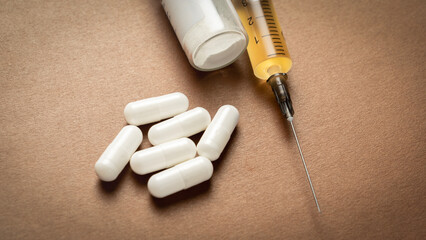 Syringe with doping and pills close-up, doping concept in sports.