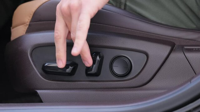 Electric seat adjustment of car. Buttons for adjusting seat position. Car interior
