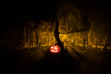 Scary view of zombies at cemetery dead tree, moon, church and spooky cloudy sky with fog, Horror...