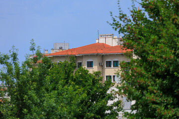 View of buildings and houses in public places in Turkey, sunny summer day