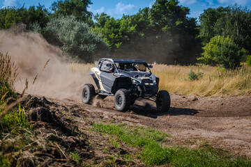 ATV and UTV riding in sandy dusty track. Amateur competitions. 4x4.