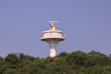 View of tower buildings and houses in public places in Turkey, blue sky and sunny summer day