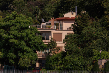 View of buildings and houses in public places in Turkey, sunny summer day