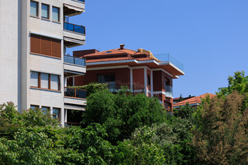View of buildings and houses in public places in Turkey, sunny summer day