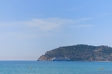 Fototapeta na wymiar View of the beach and sea, summer sunny day
