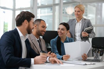 Lawyers working together at table in office