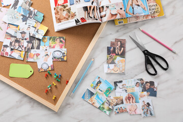 Fototapeta na wymiar Flat lay composition with different photos, magazines and stationery on white marble background. Creating vision board