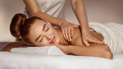 Obraz na płótnie Canvas Body Care. Woman Enjoying Shoulder Massage With Closed Eyes