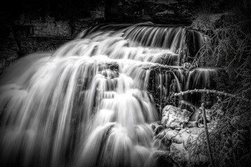 A close up black and white view of Inglis Falls near Owen Sound, Ontario as it crashes its way down...