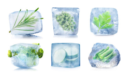 Frozen food. Different vegetables and herbs in ice cubes isolated on white, set