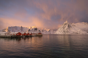 Soft and mysterious morning sunrise light over the  Hamnoy island and mountain chains along the...