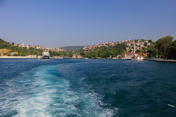 Naklejka na ściany i meble Cityscape View from the water to buildings in the city of Istanbul 