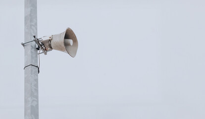 megaphone on metal pole