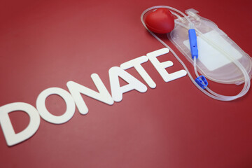 Empty blood bag with a awareness sentence, Donate now. 