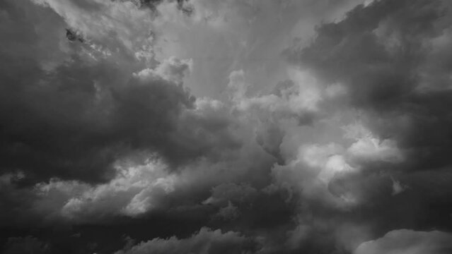 Storm clouds and lot of lightning during a thunderstorm. Dramatic clouds moving fast, 4k