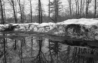 parking lot at the end of winter after snow storms in black and white