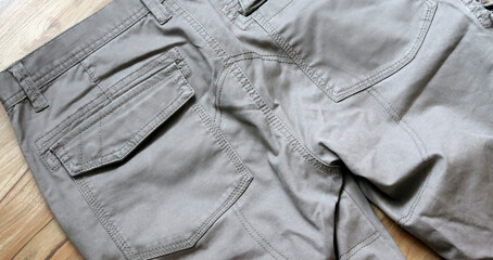 Back pocket trousers. Closeup texture with pockets - 750190050