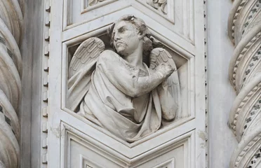 Foto op Plexiglas Angel in white marble, detail on the front gable from the Cattedrale di Santa Maria del Fiore (cathedral of Saint Mary) in Florence, Italy © annavee