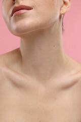 Beauty concept. Woman on pink background, closeup