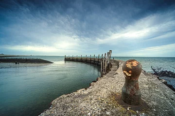Draagtas Old harbor, with mooring quay in a round concrete shape and a great view over the water and a threatening cloudy sky © fotografiecor