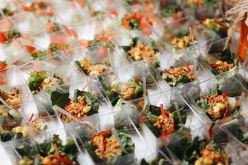 Beautifully decorated catering banquet table with different food snacks and appetizers with...