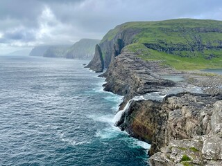 Fototapeta na wymiar cliffs near sorvagsvatn lake the biggest of Faroe Islands also called the lake above the ocean