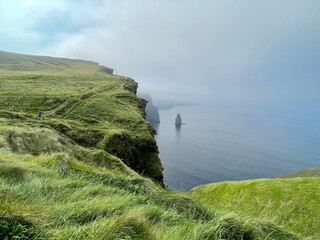 landscape with fog on the top of cliff&rsquo;s of Moher, Ireland 