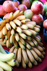 Bundle of Bananas and Apples on Sale Display at Farmers Market